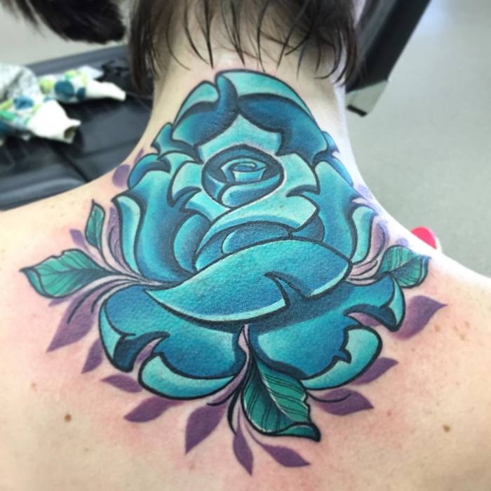 Blue Ink Rose Tattoo On Back by Greg Ross