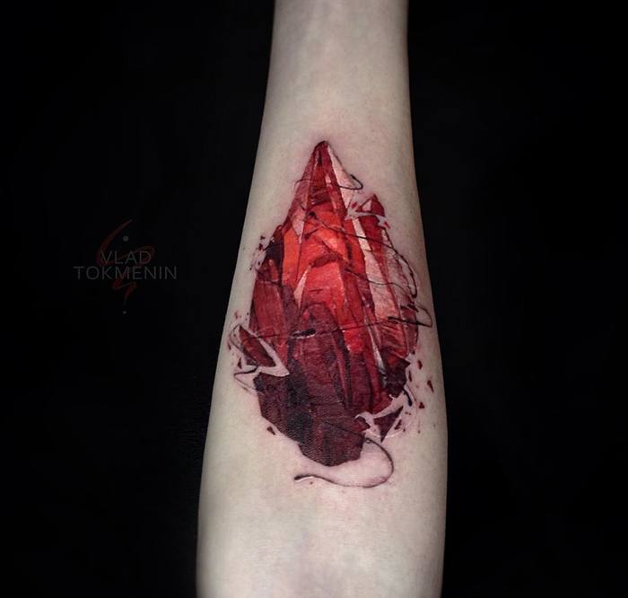 Gem tattoo on the inner forearm by Vlad Tokmenin