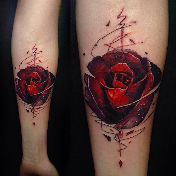 Graphic style red rose tattoo on the inner forearm by Vlad Tokmenin