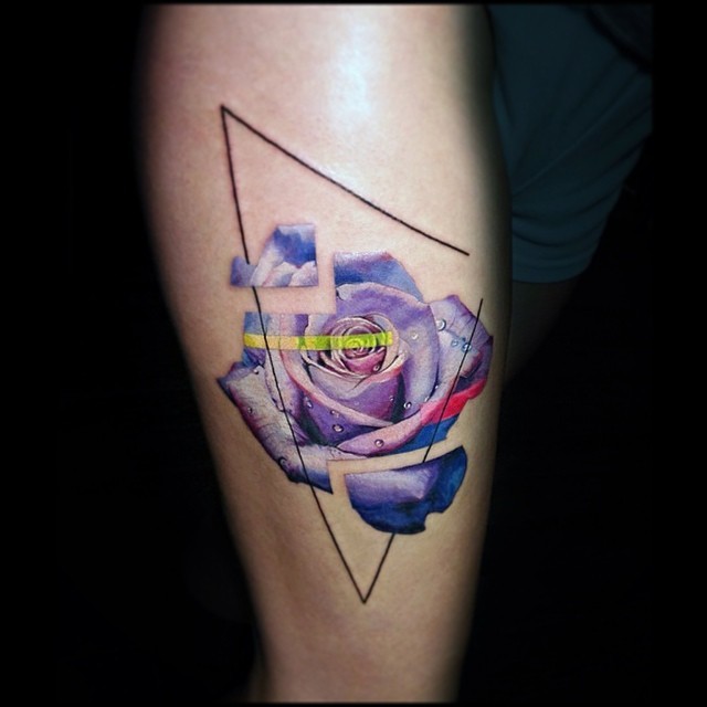 Graphic purple rose tattoo on the calf by Vlad Tokmenin