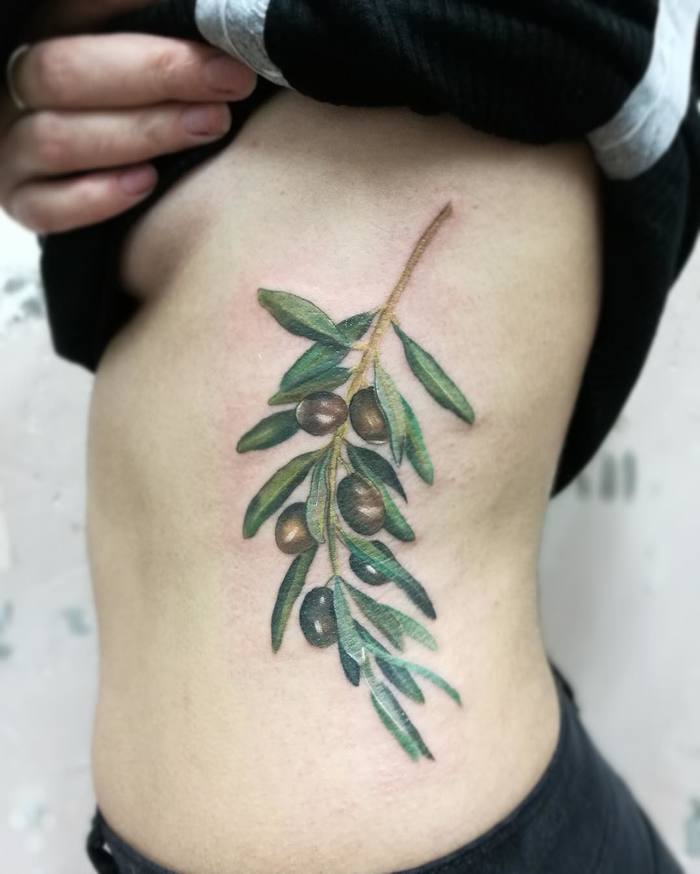 Gorgeous Olive Branch Tattoo on Side by arochatattoo