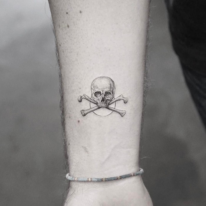 Small Skull and Crossbones Tattoo by mr.k_tattoo