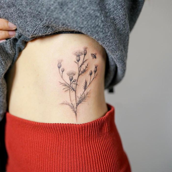 Delicate Thistle Tattoo by nandotattooer
