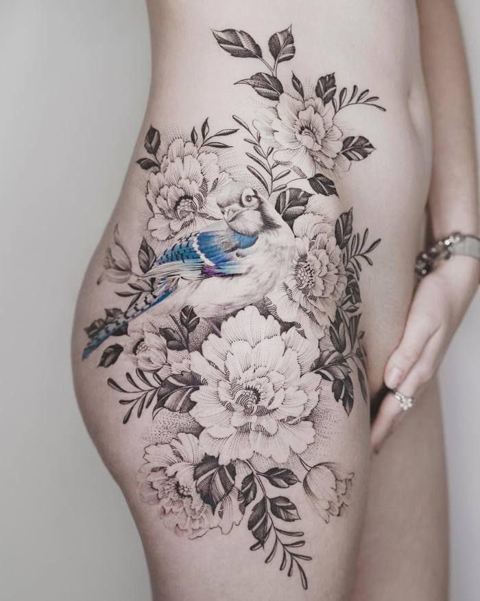 Splendid Feminine Tattoo Design on Hip by tritoan__seventhday